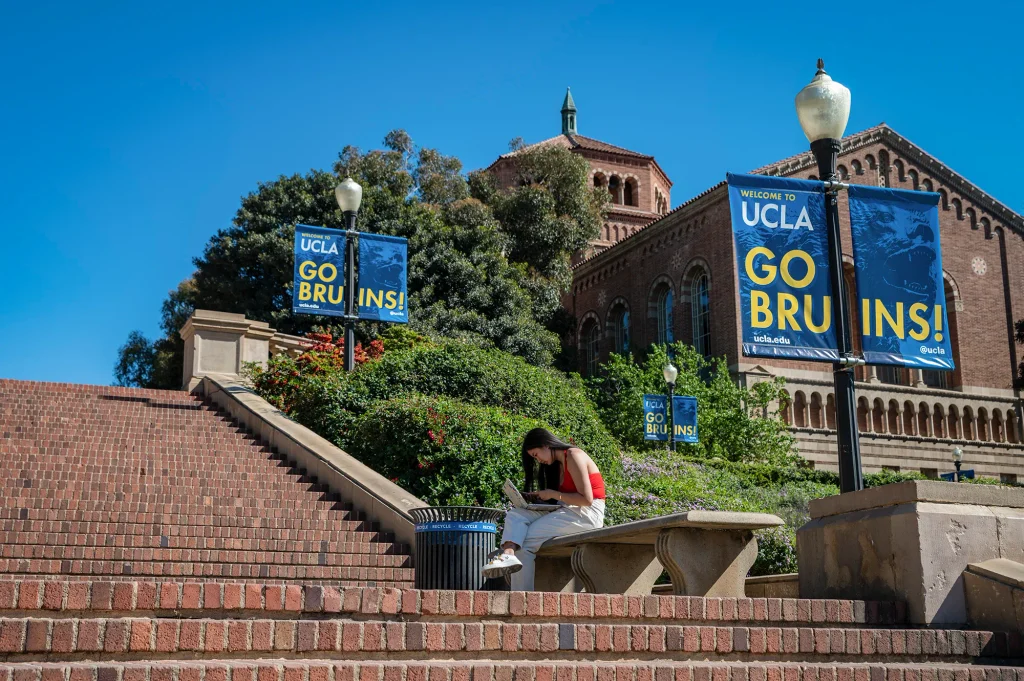 A person uses their laptop at the UCLA campus in Los Angeles on Feb. 18, 2022. Photo by Raquel Natalicchio for CalMatters