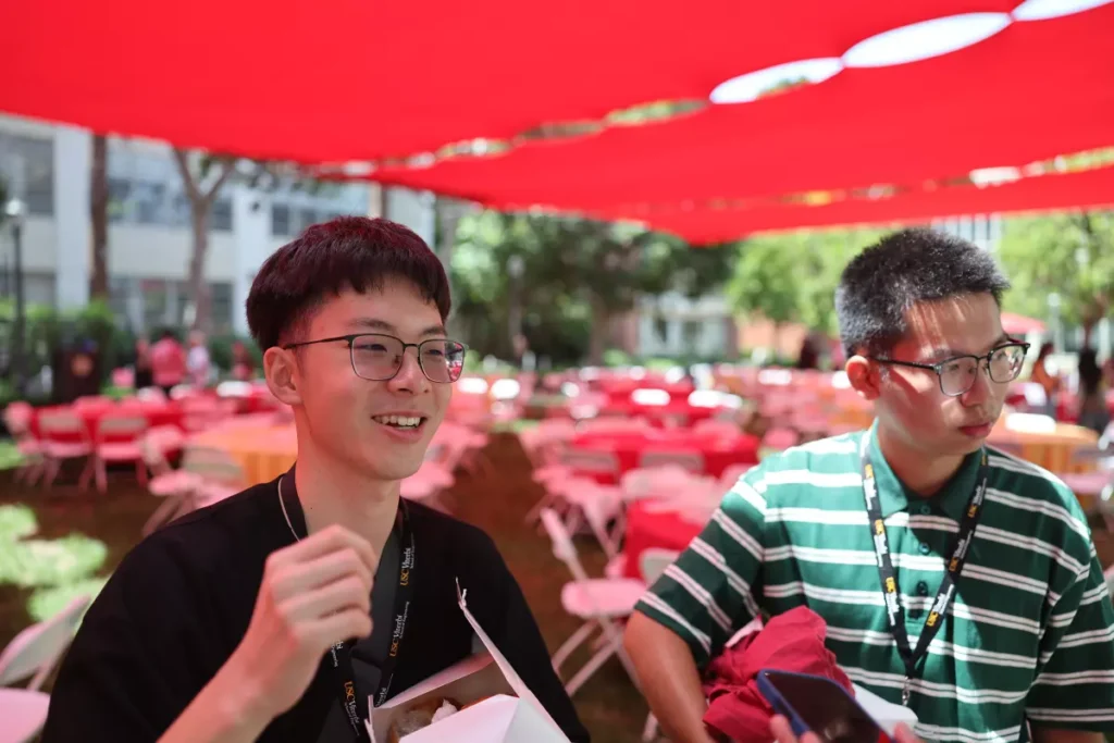 Bill Kao, left, and Duncan Deng discuss artificial intelligence during a welcome at USC’s Viterbi school. (Allen J. Schaben/Los Angeles Times)